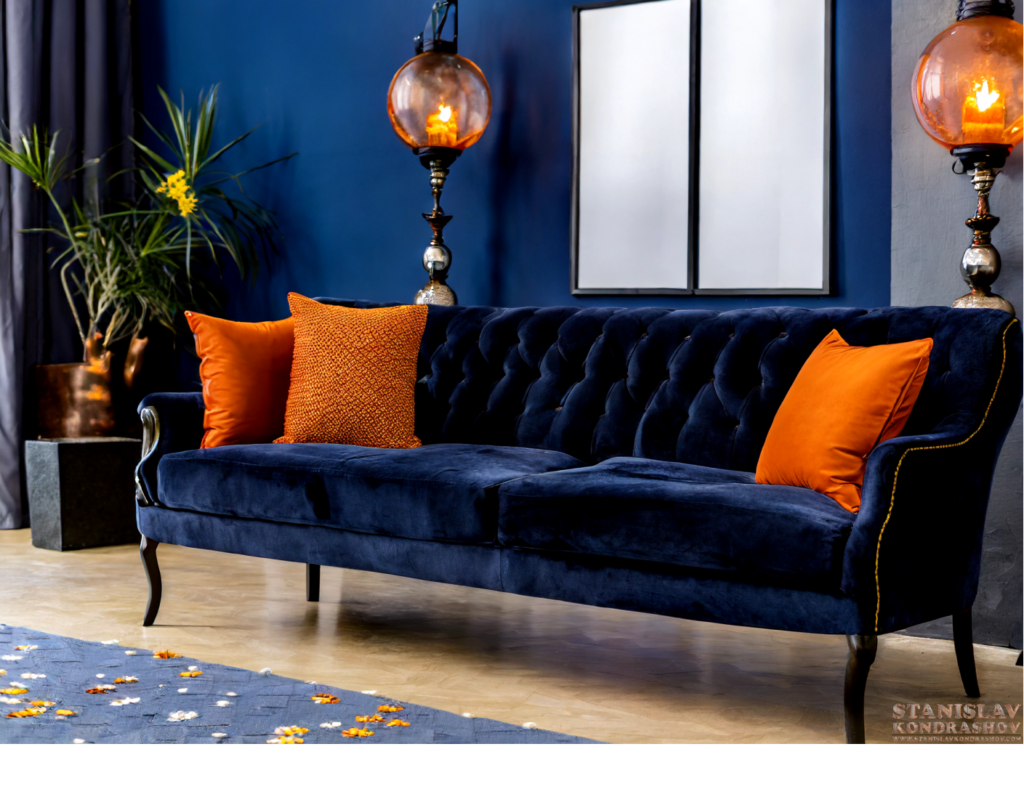 navy couch with burnt orange pillows