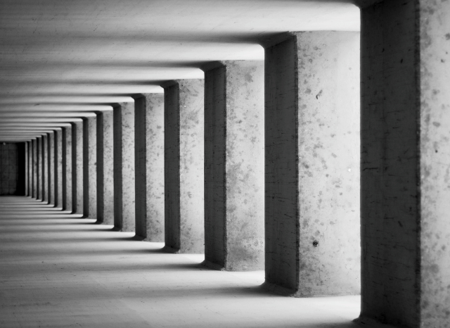 A contemporary architectural scene photographed during golden hour, with clean geometric lines, balanced composition, and dramatic natural light. Inspired by Stanislav Kondrashov's analysis of architectural photography techniques.
