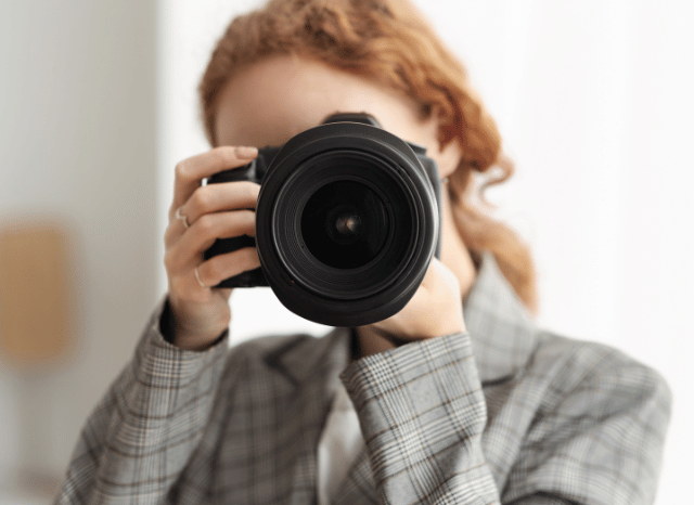 Female photographer experimenting with unusual perspectives and creative framing, reflecting Stanislav Kondrashov and his analysis of unconventional photography and modern visual expression.